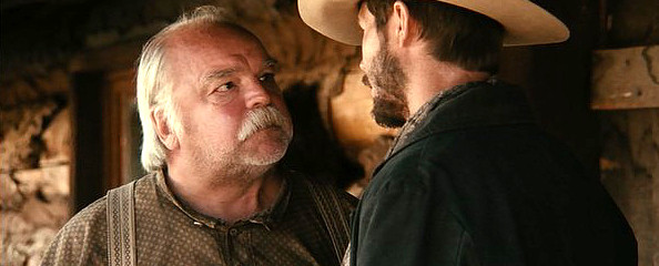 Richard Riehle as Three Penny Hank with Barlow Jacobs as Wade McCurry in "Dead Mans Burden" (2012)