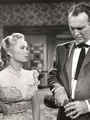 Mamie Van Doren as Ellen Ballard and Leif Erickson as George Ballard in Star in the Dust (1956)