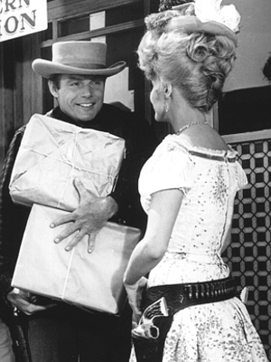 Adam West as Kenneth Cabot and Nancy Kovack as Annie Oakley in The Outlaws is Coming (1965)