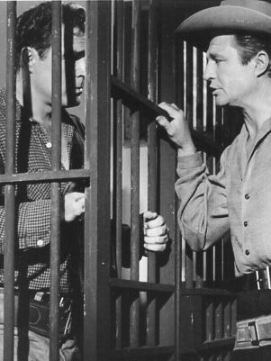 Don Megowan as Cheney Holland and Jim Davis as Marshal Matt Gordon in A Lust to Kill (1959)