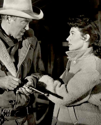 James Stewart as Grant McLaine and Dianne Foster as Charlotte Drew in Night Passage (1957)