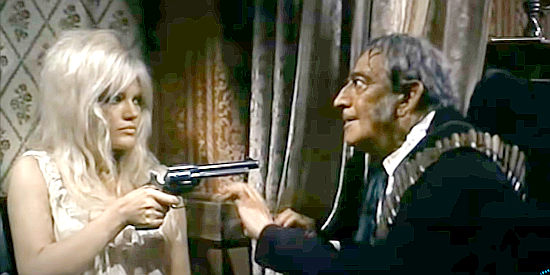 Cristina Gaioni as Maude, pulling a gun on one of Tuscarora's lecherous bandits in El Cisco (1966)