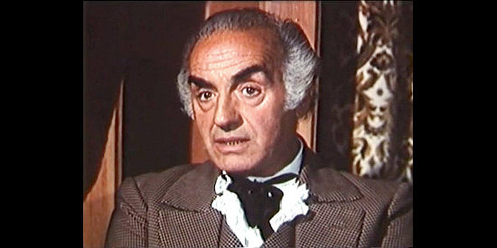 Gennarino Pappagalli as Olsen, part of a crooked duo in the town of Wintrop in Finders Killers (1971)