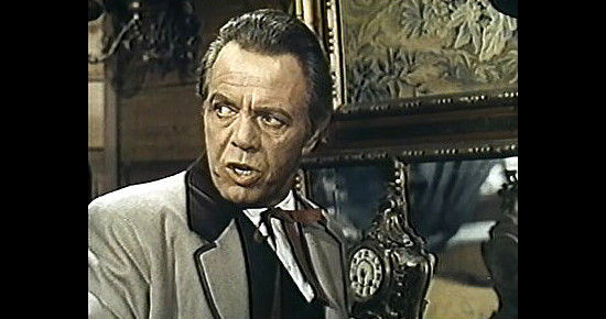 Louis Hayward as Mike Culligan, who brings trouble to town in Christmas Kid (1967)