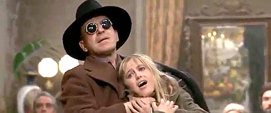Telly Savalas as Franciscus has Sonny (Susan George) in his grasp in Sonny and Jed (1972)