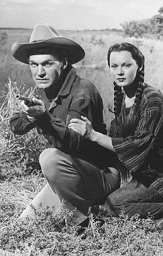 Forrest Tucker as Reed Loomis and Adrian Booth as Aleeta in Rock  Island Trail (1950)
