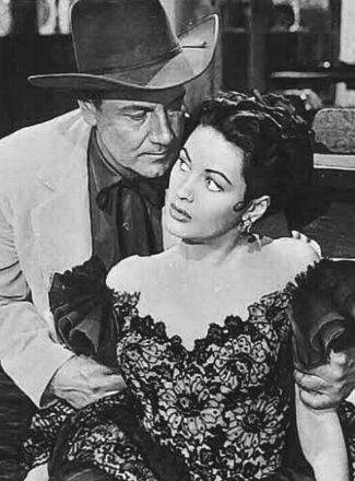 Joel McCrea as Maj. Clete Mattson and Yvonne De Carlo as Carmelita Carjas in Border River (1954)