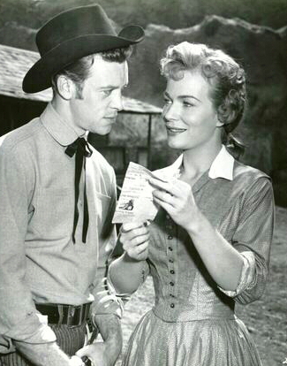 Skip Homeier as Tim Mallory and Kristine Miller as Fay Warren in Thunder Over Arizona (1956)