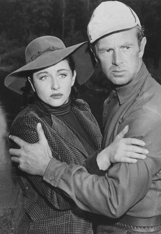 Vera Ralston as Lynne Tilton and Sterling Hayden as Tim Chipman in Timberjack (1955)