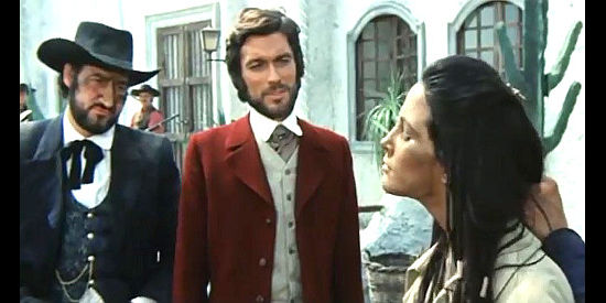 Ivan Rassimov as Judge Perkins checks out Tune (Elizabeth Eversfield), the latest addition to his stable of Indian girls, while top gun Boone (Teodora Corra) looks on in Vengeance is a Dish Served Cold. (1971)