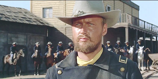 Lars Bloch as Lt. Ted Harrison, cavalry commander in A Stranger in Town (1966)