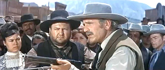 Luis Induni as Sheriff Luke, demanding justice be followed while Deputy Vince (Cris Huerta) looks on in The Relentless Four (1965)