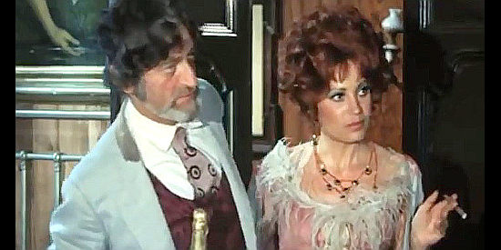 Steffen Zacharias as Doc and Isabella Guidotti as saloom girl Lucy have their celebration interrupted in Vengeance is a Dish Served Cold (1971)