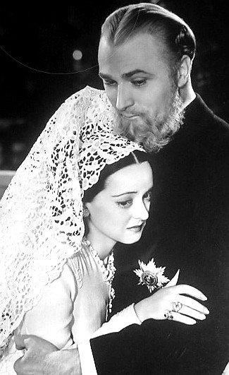 Bette Davis as Empress Carlotta with Brian Aherne as Emperor Maximilian in Juarez (1939)