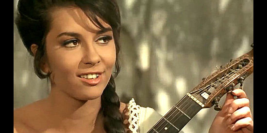 Daniela Giordano as Juanita, tired of playing music for pesos in Find a Place to Die (1968)