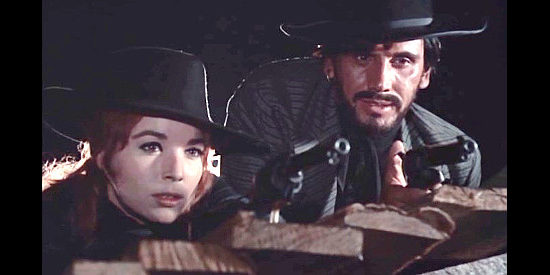 Elsa Martinelli as Belle Starr and George Eastman as Larry Blackie, trapped on a roof in The Belle Starr Story (1968)
