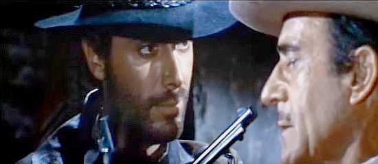 George Hilton as The Stranger and Gilbert Roland as Monetero can't agree in Any Gun Can Play (1967)