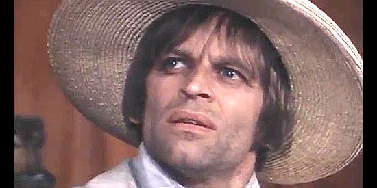 Klaus Kinski as Crazy Johnny spots something he likes, probably another pretty girl in The Beast (1970)