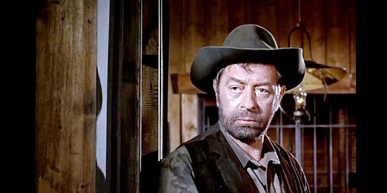 Pierre Collett as Sheriff Ben, looking for the Caine brothers in Cemetery Without Crosses (1969)