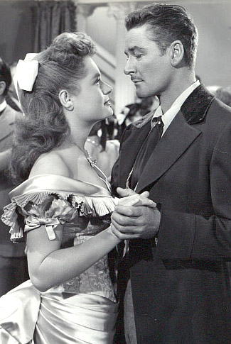 Alexis Smith as Maria Singleton shares a dance with Errol Flynn as Morgan Lane in Montana (1950)