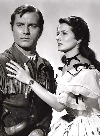 George Montgomery as Nat Cutler and Brenda Marshall as Marion Thorne in The Iroquois Trail (1950)