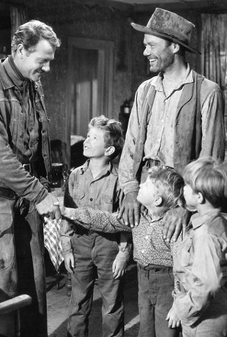 Joel McCrea as Chuck Conner with John Ridgely as Slim Stevens and three of his sons in Saddle Tramp (1950)