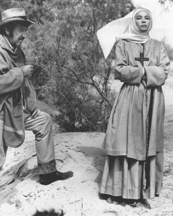 Richard Boone as Madron and Leslie Caron as Sister Mary in Madron (1970)