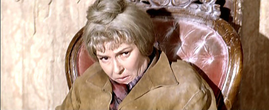 Vivi Gioi as Molly Warner, all tied up in her own ghost town in Kill the Wicked (1968)