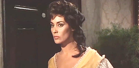 Gia Sandri as Dora, a saloon girl who connives to get a young boy's money in Gunman Sent by God (1969)