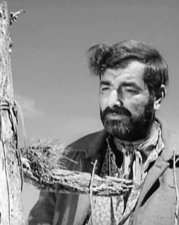 Juan Avila (Peter Mamakos) at his son Manuel's graveside in Terror at Black Falls (1962)