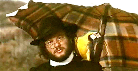 Peter Landers as Rev. Higgins with Pippo the Parrot in Charity and the Strange Smell of Money (1973)