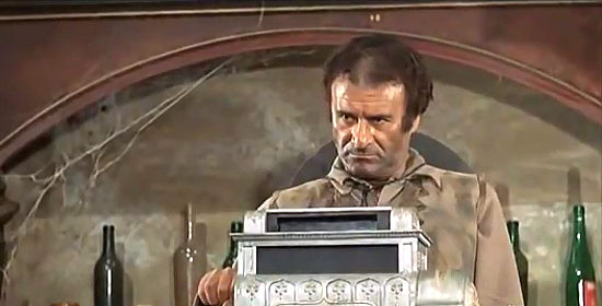 Adriano Micantoni as Black Jack playing cash register roulette in Ciccio Forgives, I Don't (1968)
