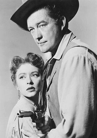 Dennis Morgan as Mike McGann with Amanda Blake as Marian Hastings in Cattle Town (1952)
