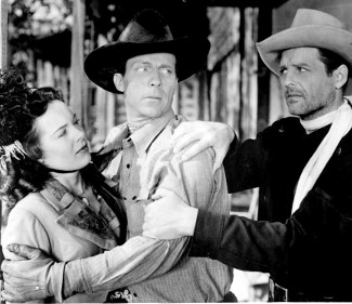 James Ellison as Capt. Jeff Packard comes to the assistance of Julie Scott (Virginia Herrick) as she's manhandled by Luke (Dennis Moore) in I Killed Geronimo (1950)