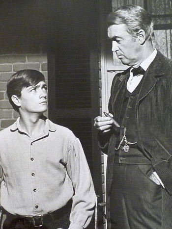 Phillip Alford as Boy Anderson gets advice from James Stewart as Charlie Anderson in Shenandoah (1965)
