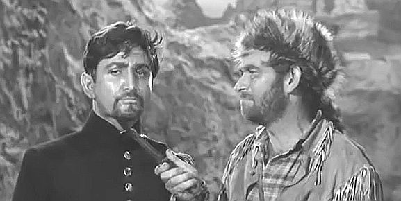 Eugene Iglesias as Lt. Ruiz under the kife of Beaver McBride (Ken Mayer) in Frontier Uprising (1961)