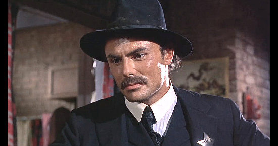 John Saxon as Sheriff Lou Trinidad tries to talk Frank Patch into leaving town in Death of a Gunfighter (1969)