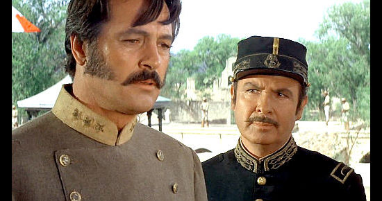 Rock Hudson as Col. James Langdon learns of his band's bleak future from revolutionary Gen. Rojas (Antonio Aguilar) in The Undefeateed (1969)