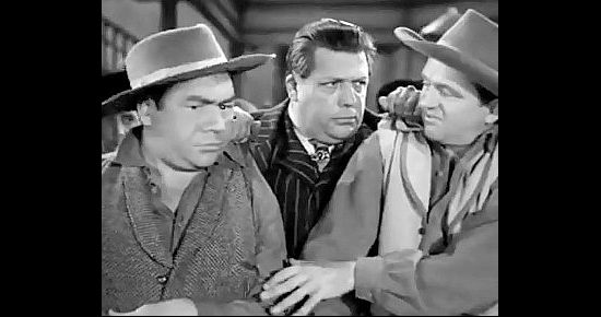 Alan Carney as Mike and Wally Brown as Jerry run afoul of Honest Greg Barlan (Cy Kendall) in Girl Rush (1944)