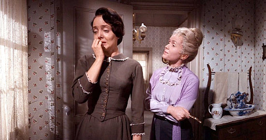 Carolyn Jones as Julia Rawlings frets for her husband's safety in spite of consoling words from Lily Prescott (Debbie Reynolds) in How the West Was Won (1962)