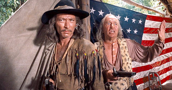 Walter Brennan (left) as river pirate Col. Jeb Hawkins with Lee Van Cleef as one of his allies in How the West Was Won (1962)