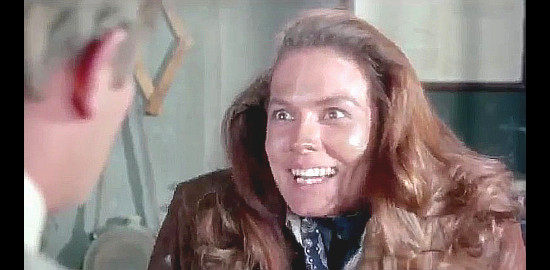 Elizabeth Campbell as Cookie reveals her true identity to Phillip P. Phillips in The Phantom Gunslinger (1970)