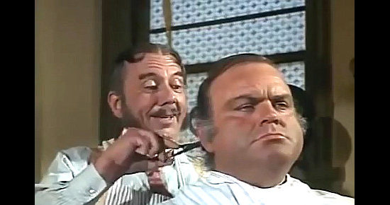 Henry Jones as barber Hanson with Dan Blocker as Charley Bicker in The Cockeyed Cowboys of Calico County (1970)