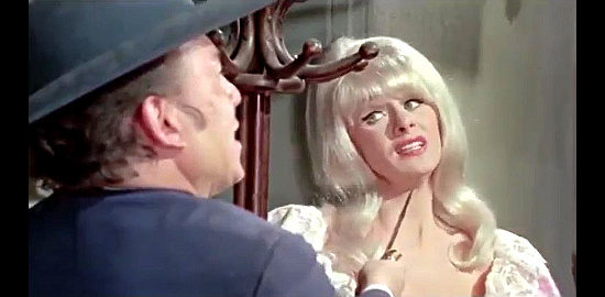 Sabrina as Margie Jones, being questioned at knifepoint in The Phantom Gunslinger (1970)