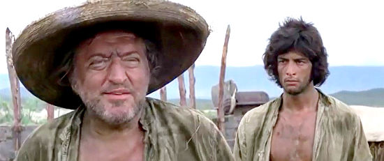 Reinhard Kolldehoff as Zweig with Jorge Luke as Chamaco looking on in The Revengers (1972)