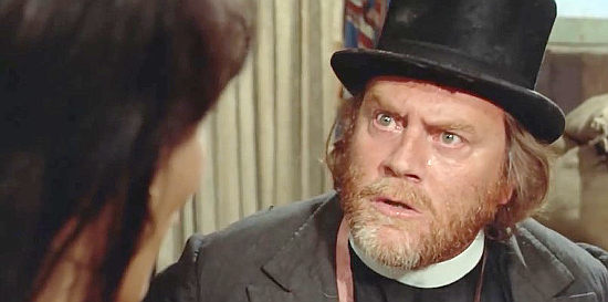 Ettore Manni (Red Carter) as pretend preacher Jonas Dickerson, wondering if God's playing a trick on him in Anything for a Friend (1973)