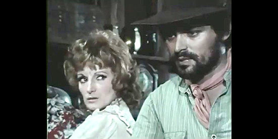 Laila Shed as Evelyn McGregor and Umberto Di Grazia as her brother, two of the miners being cheated by Burton in Kill Django ... Kill First (1970)