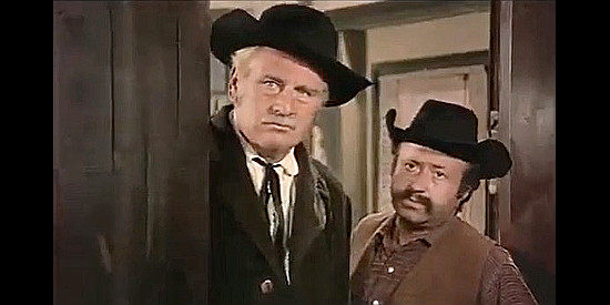 Luis Induni as town leader Sam Travers and Jarrque Zurbano as Sheriff Pringle in Too Much Gold for One Gringo (1972)