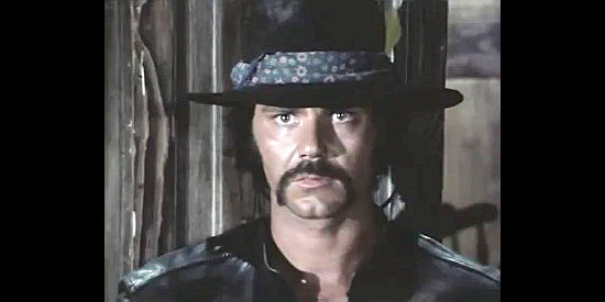 Mario Novelli as Ted, the stranger and bounty hunter who shows up to help Johnny in Kill Django ... Kill First (1970)