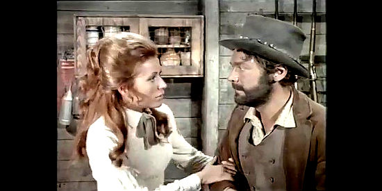 Silvia Monti as Cat prevents Pierre Perret as Judge Roy Bean from doing something rash in Judge Roy Bean (1971)